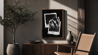 ASAP Rocky At Long Last Rings poster framed above a fluted sideboard beside a potted tree