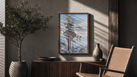 ice skaters on a frozen lake among snowy pines vintage art print poster framed above a fluted sideboard beside an olive tree