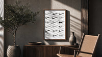 Nike Swoosh Hand-Drawn Sketch framed poster poster framed above a fluted sideboard beside an olive tree