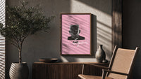 Tyler the Creator IGOR poster framed above a fluted sideboard beside a potted tree