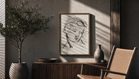 woman's head in flowing contour lines vintage art print poster framed above a fluted sideboard beside an olive tree
