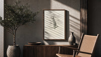 tern in flight sketch vintage art print poster framed above a fluted sideboard beside an olive tree