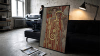 Klimt's Hygieia with gold serpent vintage art print print in a slim black frame leaning on a dark sofa in a concrete…