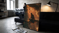 Itachi Uchiha Naruto Akatsuki framed poster print in a slim black frame leaning on a dark sofa in a concrete print studio