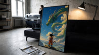 Dragon Ball Z Goku and Shenron framed poster print in a slim black frame leaning on a dark sofa in a concrete print studio