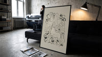 three horses vintage art print print in a slim black frame leaning on a dark sofa in a concrete print studio