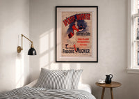 Aperitif Mugnier Cafe print in a black frame above a bed with striped linens, a brass wall lamp and a sunlit window