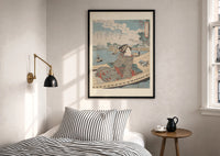 Kuniyoshi Water Scene with Boat print in a black frame above a bed with striped linens