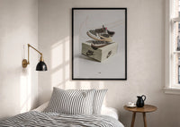 Air Jordan 1 Travis Scott Reverse Mocha print in a black frame above a bed with striped linens