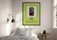 Frank Ocean Blonde Album Cover print in a black frame above a bed with striped linens, a brass wall lamp and a sunlit window