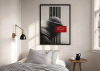 Hypebeast Motivational Portrait Glitch print in a black frame above a bed with striped linens