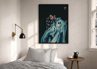 Drake If You're Reading This It's Too Late print in a black frame above a bed with striped linens