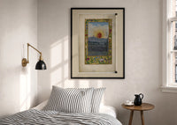 Splendor Solis The Sun print in a black frame above a bed with striped linens, a brass wall lamp and a sunlit window