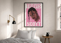 Travis Scott Cactus Jack Portrait print in a black frame above a bed with striped linens