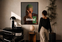 Blond Frank Ocean Album Cover Portrait print in a black frame on a sunlit wall with a viewer