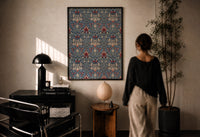 William Morris Snakeshead print in a black frame on a sunlit plaster wall, a woman looking on beside a mushroom lamp