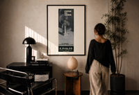 Crepe de Chine Millot Parfum print in a black frame on a sunlit plaster wall, a woman looking on beside a mushroom lamp