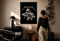 Metallica Decaying Corpse Skeleton print in a black frame on a sunlit wall with a viewer