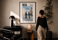 Pink Floyd Wish You Were Here Burning Handshake print in a black frame on a sunlit wall with a viewer