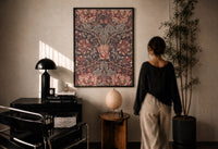 William Morris Honeysuckle print in a black frame on a sunlit plaster wall, a woman looking on beside a mushroom lamp