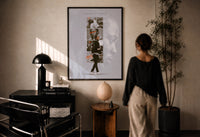 Kendrick Lamar DAMN Collage print in a black frame on a sunlit plaster wall, a person looking on beside a mushroom lamp