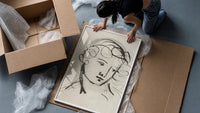 woman's head in flowing contour lines vintage art print framed print being unpacked from protective bubble wrap and a box