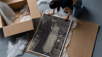 couple embracing on a night balcony vintage art print framed print being unpacked from protective bubble wrap and a box