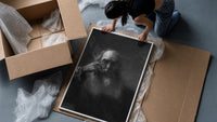 elderly bearded man in shadow vintage art print framed print being unpacked from protective bubble wrap and a box