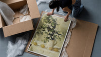 flowers and lemons still life vintage art print framed print being unpacked from protective bubble wrap and a box