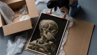 skeleton smoking a cigarette vintage art print framed print being unpacked from protective bubble wrap and a box