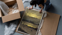 beach at sunset with silhouetted figures vintage art print framed print being unpacked from protective bubble wrap and a box