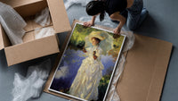 woman with a parasol beside a lily pond vintage art print framed print being unpacked from protective bubble wrap and a box