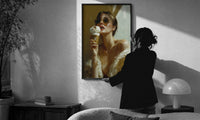 Louis Vuitton Gold Ice Cream print in a slim black frame being hung on a sunlit wall in a monochrome room