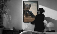 KAWS Companion Desert Monochrome Streetwear print in a slim black frame being hung on a sunlit wall in a monochrome room