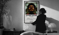 The Weeknd After Hours Album Cover print in a slim black frame being hung on a sunlit wall in a monochrome room