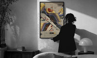 Nike Air Max 1/97 Sean Wotherspoon print in a slim black frame being hung on a sunlit wall in a monochrome room