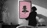 Tyler the Creator IGOR print in a slim black frame being hung on a sunlit wall in a monochrome room