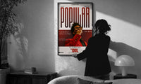 The Weeknd Popular Idol Magazine Cover print in a slim black frame being hung on a sunlit wall in a monochrome room