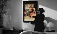 Arthur Rackham Marley's Ghost print in a slim black frame being hung on a sunlit wall in a monochrome room