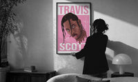 Travis Scott Cactus Jack Portrait print in a slim black frame being hung on a sunlit wall in a monochrome room