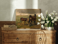 Group of horses in field print in an oak frame on a farmhouse dresser beside white tulips