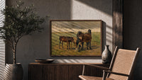 Group of horses in field print in a wood frame above a fluted sideboard beside an olive tree