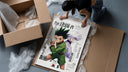 Gon and Killua anime characters framed print being unpacked from protective bubble wrap and a box