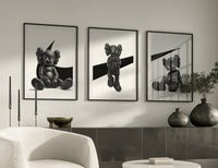 KAWS x Nike Monochrome Companion Triptych poster styled above furniture in a modern room