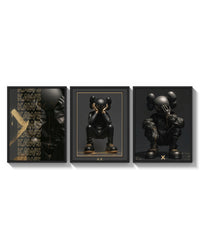 KAWS Noir XX Black Gold Poster Set of 3 arranged on a bright gallery wall