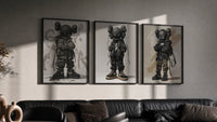 KAWS Nike Street Wall Art Set of 3 in black frames on a grey wall above a leather sofa