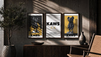 KAWS Monogram Impact Hypebeast Wall Art Set of 3 in walnut frames above a sideboard in a warm room