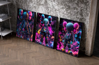 KAWS Neon Battle Figures Set of 3 as black-framed prints leaning against a raw-plaster wall