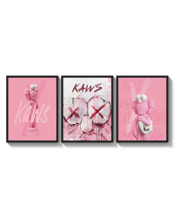 Bubblegum Pink KAWS XX Hypebeast Wall Art Set of 3 arranged on a bright gallery wall