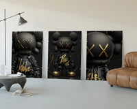 KAWS Black Label XX Hypebeast Wall Art Set of 3 displayed beside a brown leather sofa